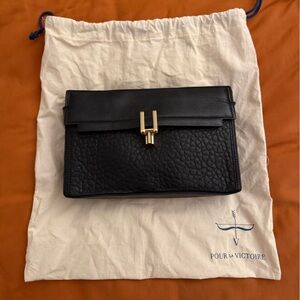 Pour La Victoire Textured Black Clutch with Gold Accent